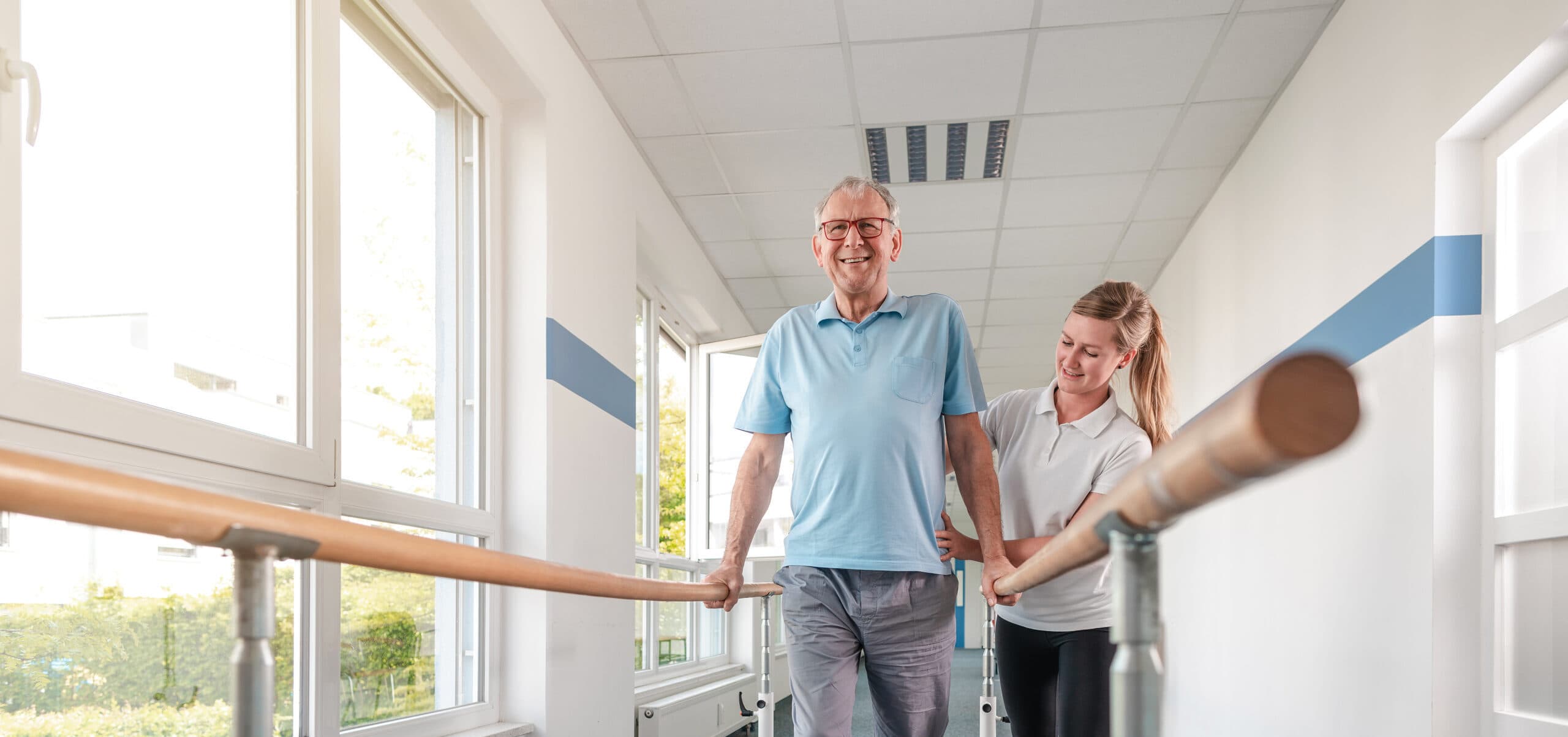 Senior Patient and physical therapist in rehabilitation walking exercises.